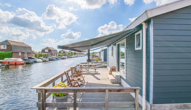 Modern chalet with private jetty on the water