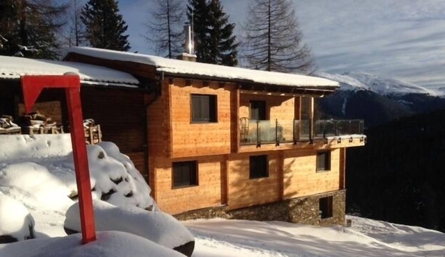 Modern comfortable spacious mountain chalet with wellness area and tiled stove
