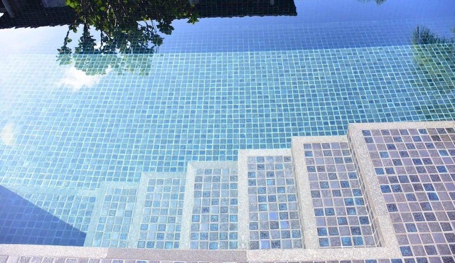 Modern duplex apartment on the beach with direct pool access