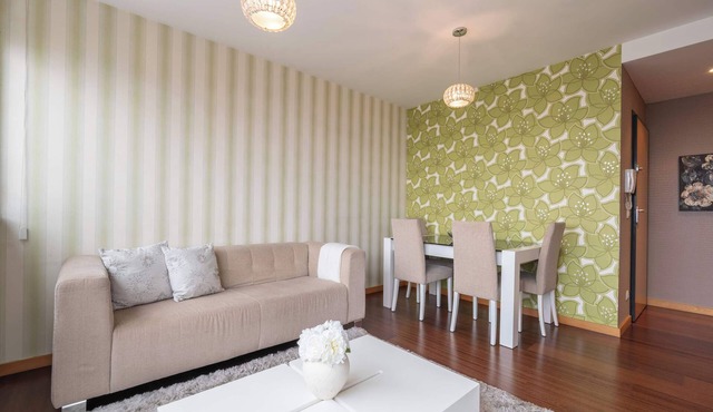Modern Flat with Balcony & Garage by HostWise