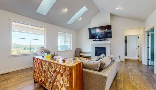 Modern home with fireplace, private patio, remote workspace, & golf nearby