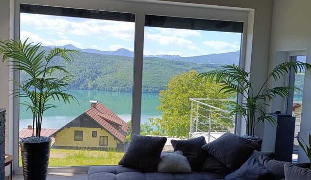 Modern house in the woods with a view of the Millstattersee