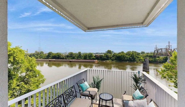 Modern river-view condo with balcony & WiFi - walk to downtown & attractions
