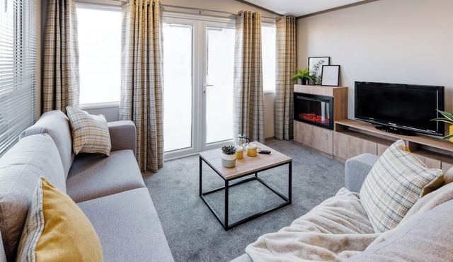 Modern, spacious holiday caravan with two bedrooms sleeping four people.