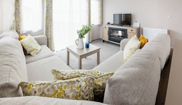 Modern, stylish and spacious 12ft-wide caravan with one double and one twin.