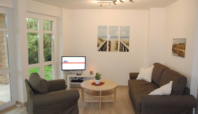 Modern vacation apartment Strandgeist on Fehmarn with terrace and garden view