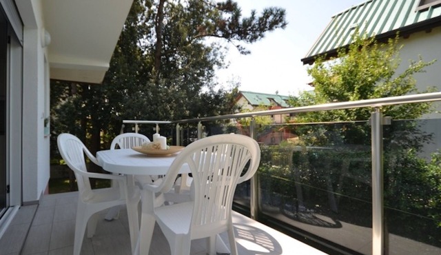 Modern villa surrounded by a fenced garden