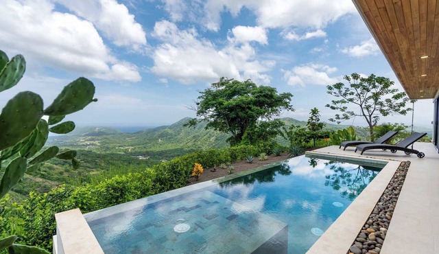 Mountainside Home with Modern Design, Sweeping Ocean Views & Private Swimming Pool