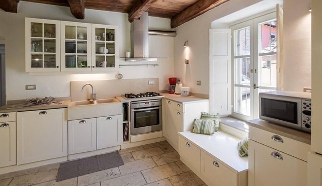 Move into this cozy stone house in the green nature of Tuscany.