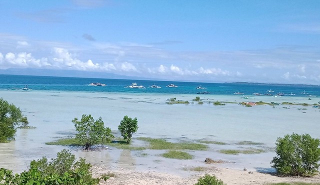 Native but modern, detached Bohol villa with 30 mile sea and island views!