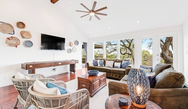 Natural cliffside oasis with impressive views, gas fireplace and dock