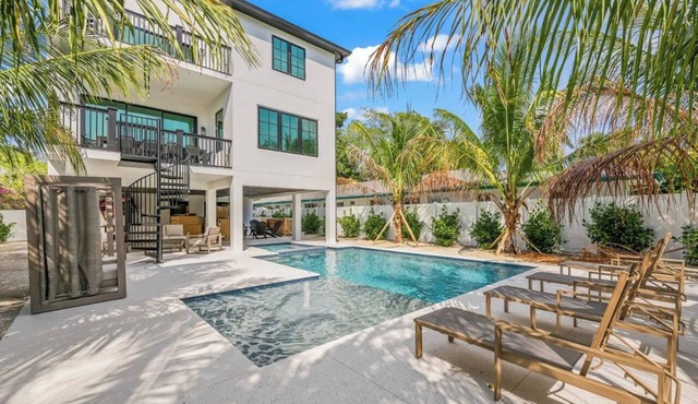 New 8 bedroom house with tropical oasis backyard! Heated pool and spa.