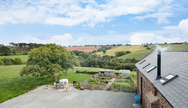 NEW Barn Conversion. Idyllic and unspoiled views complete with Hot Tub & Fire