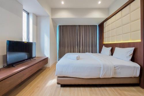 Nice and Spacious 2BR with Extra Room at Branz BSD City Apartment By Travelio