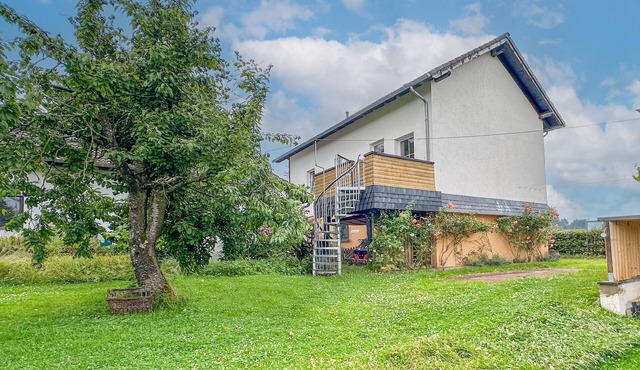 Nice house with garden and children's facilities