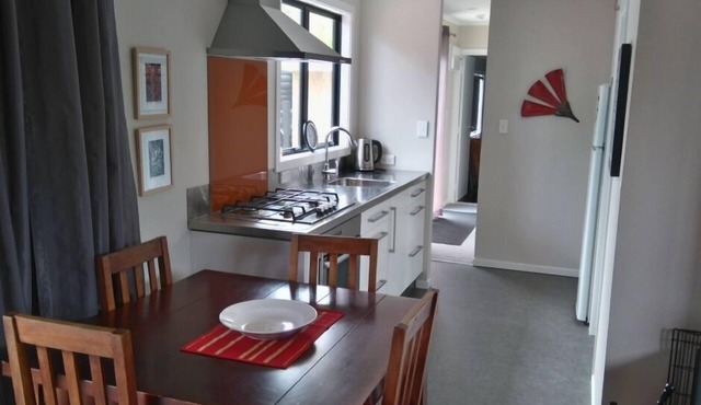 Now with unlimited fibre broadband! Warm,2 bedroom bach in quiet,sunny location.
