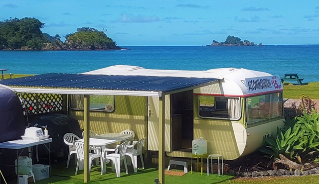 Oakura Beachfront Caravan offers you cheap budget beachfront accommodation