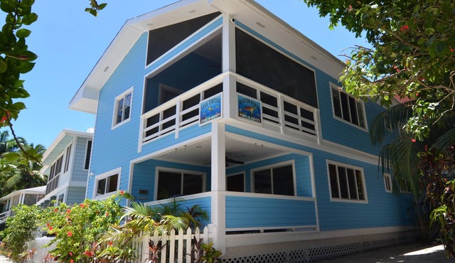 Oceanfront beach house with dual-masters & screened balcony on West Bay Beach