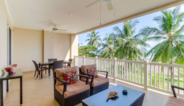 Oceanfront condo with sweeping beach views, pool & private balcony