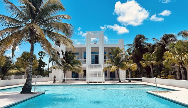 Oceanfront Dream Villa. Expansive pool, game room, rooftop lounge, kitchen.