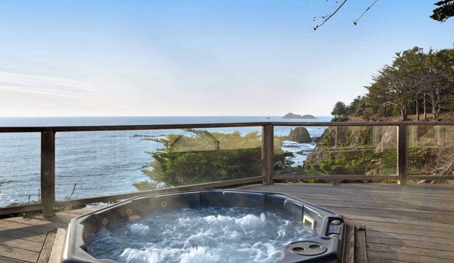 Oceanfront home with private hot tub, views, & close beach access