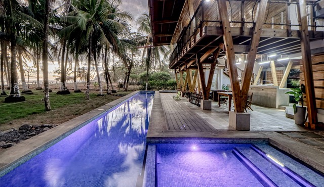 Open, dog-friendly, beachfront house with a private pool, pool spa, & WiFi