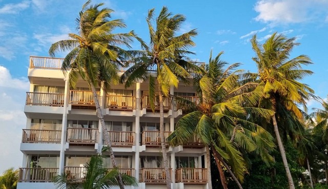 Overlooking ocean that meets cloudless sky, Coral Inn is a sanctuary of serenity