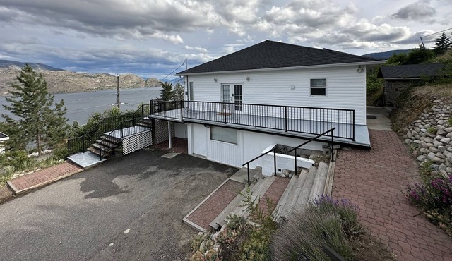 Panoramic sweeping water & mountain view house.