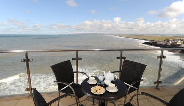 Panoramic views over the beach from a stylish apartment in a landmark building.