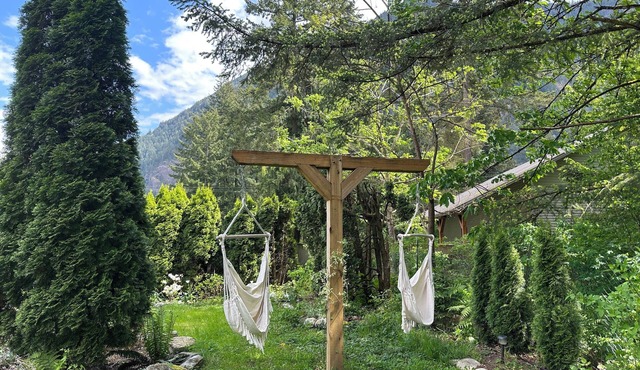 Peaceful mountainview suite surrounded by forest and gardens.