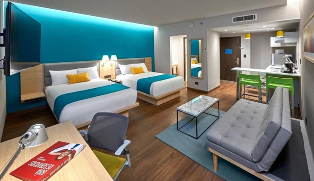 Perfect for Groups: 2-Room Stay Near Airport + Pool, Free Shuttle & Breakfast