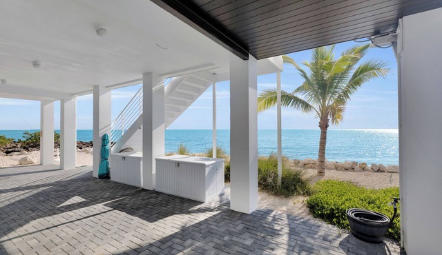 Pet Friendly 2BR/2BA Steps from the Water’s Edge with Unparalleled Sunrises