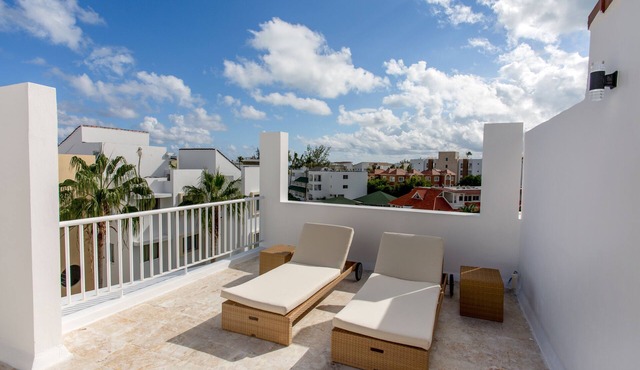 Pristine Beach with Crystal-clear water for your getaway. 4BR, Pool, Rooftop.