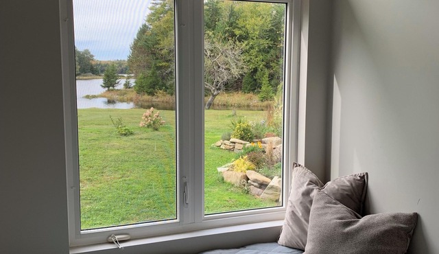 Private cottage on 8 wooded and flower-filled acres at Lake Wentworth and the Wentworth River