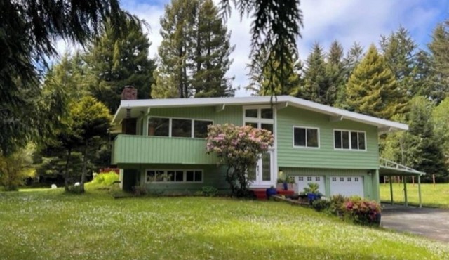 Private mid-century modern hideaway in forest near the river and sea.