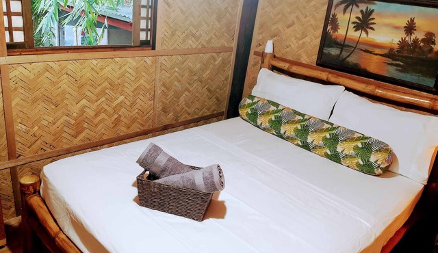 Private traditional kubo with mountain views on a peaceful Zambales farm