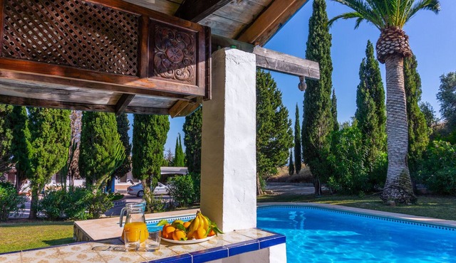 Private villa on a large estate with pool and tennis courts.