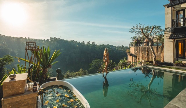 Private villa that offers a view of Mount Agung and lush jungle.