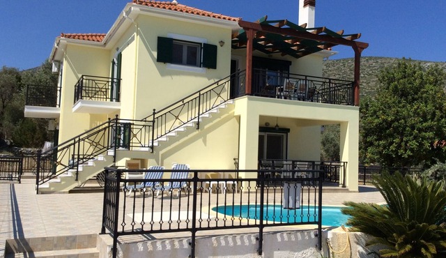 Private villa with pool, seconds from sandy beach!