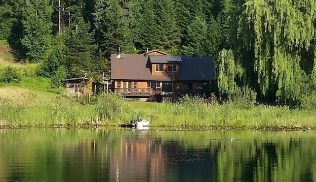 Quiet Lake Front House with great view. Large deck and yard with its own dock!