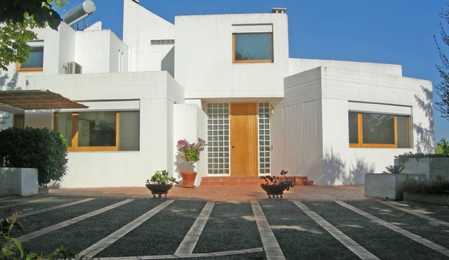 Refined modern architectural design villa in typical Apulian landscape.