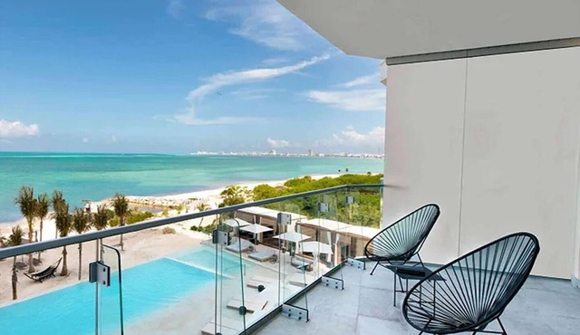 Refreshing Getaway with Scenic Pool and Beach Access | 1 BR Oceanfront Stay