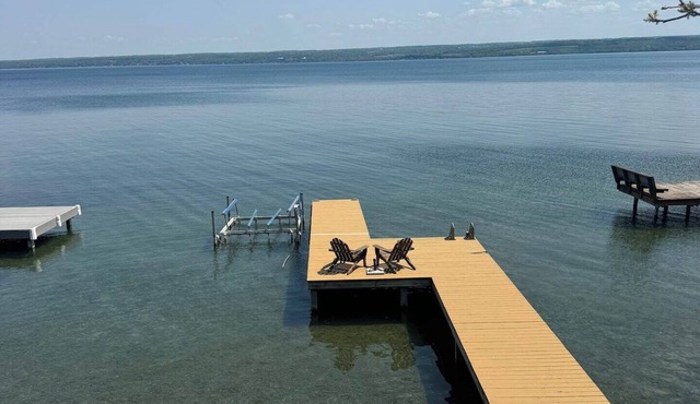 Relax at Poplar Beach Retreat on the sparkling waters of Cayuga Lake. This charming waterfront escape combines rustic character with bright, comfortable living spaces, creating the perfect setting for a relaxing Finger Lakes getaway.