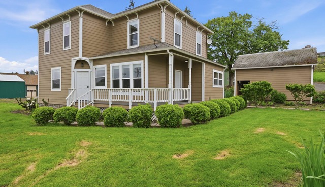 Relax at Stephens Legacy Farmhouse, a spacious 4BR retreat with valley and mountain views