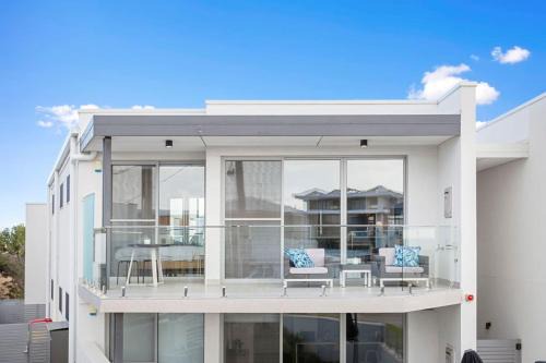 Relax in blissful sun-soaked luxury by the beach