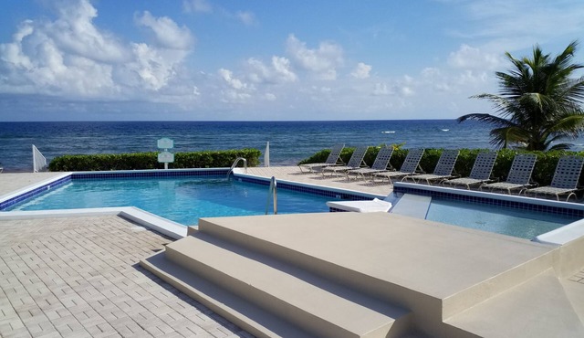 Relax in Cayman Casual style. Modern convenience in a quiet beachfront setting.