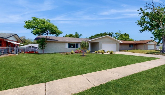 Relaxing, single-level home with a sunroom, large yard, central AC, & fast WiFi