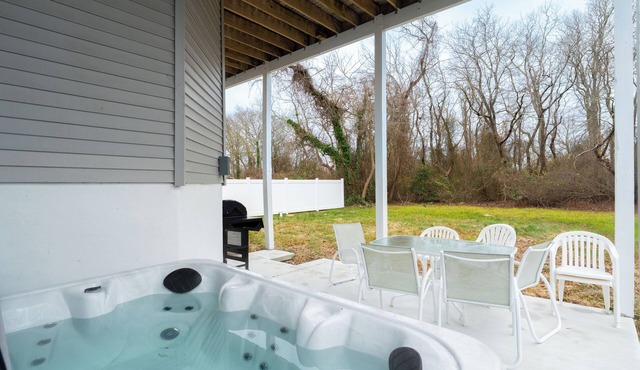 Renovated 6 bedroom home near the beach with hot tub, yard & sunset views.