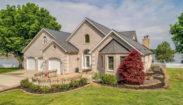 RESORT LIVING 30 MINUTES FROM THE ARCH! GORGEOUS WATERFRONT HOME AWAITS!