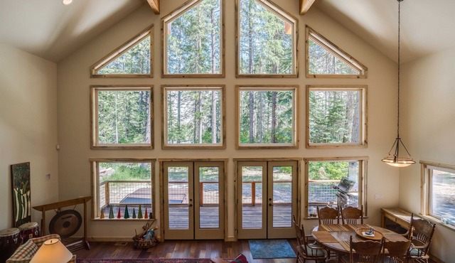 Riverfront cabin with a hot tub & fireplace.